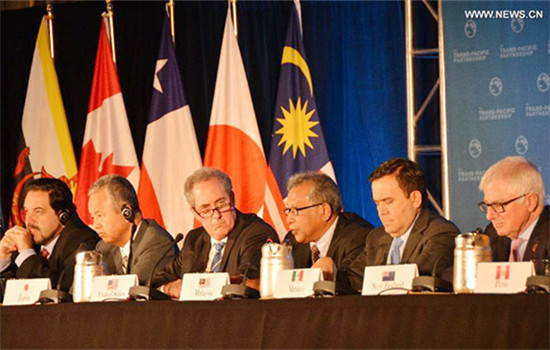 Trade ministers of the United States and 11 other Pacific Rim countries attend a press conference after negotiating the Trans-Pacific Partnership (TPP) trade agreement in Atlanta, the United States, on Oct. 5, 2015. (Photo/Xinhua)