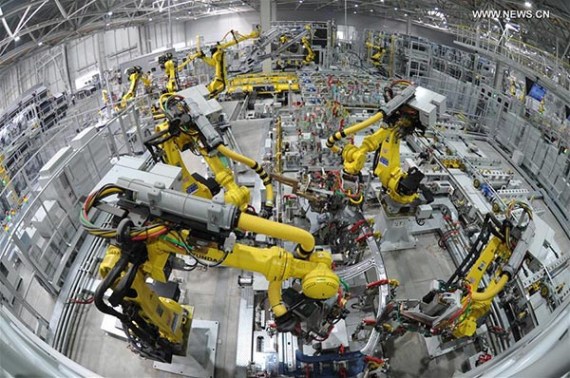 Robots work on a production line at a car factory in Cangzhou city, north China's Hebei Province, Oct. 18, 2016. (Xinhua/Mou Yu)