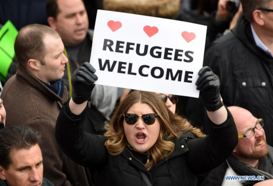 Demonstrators participate in a protest against U.S. President Donald Trump's executive order temporarily barring all refugees and seven Mideast and North African countries' citizens from entry into the U.S. in front of the White House in Washington D.C., the Unite States, on Jan. 29, 2017.  (Xinhua/Yin Bogu)