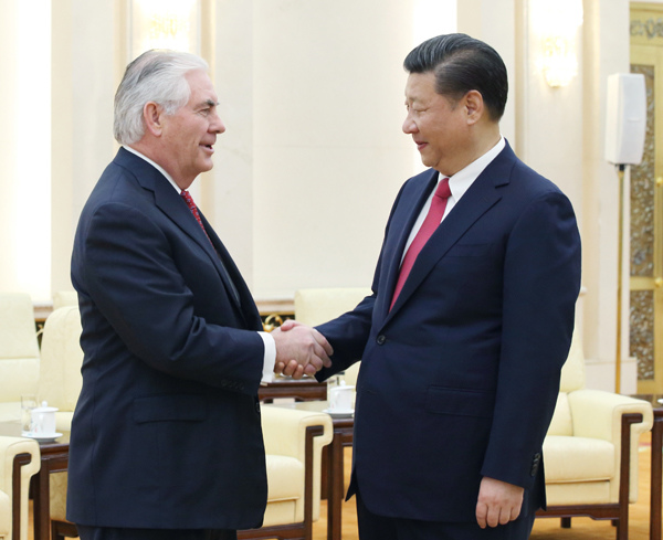 President Xi Jinping tells visiting US Secretary of State Rex Tillerson that the nations should enhance exchanges at all levels. They met on Sunday at the Great Hall of the People in Beijing. (Photo/Xinhua)