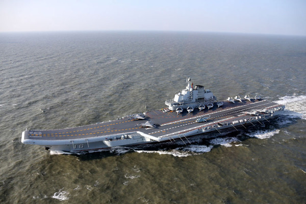 Chinese aircraft carrier Liaoning returns to Qingdao, China after Pacific drill, January 13th, 2017. Comprised of aircraft carrier Liaoning, a number of destroyers, some J-15 carrier-based fighter jets and helicopters, the fleet sailed through the Bohai Sea, the Yellow Sea, the East China Sea and the South China sea. (Photo/CRI)