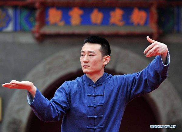 A participant performs Taichi during a Taichi national contest in Beijing, capital of China, May 15, 2015. (Photo/Xinhua)
