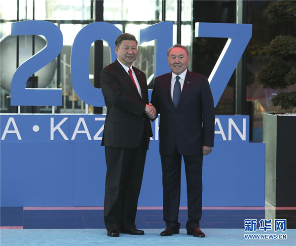 President Xi Jinping (L) is welcomed by his Kazakh counterpart Nursultan Nazarbayev when attending the opening ceremony of the Expo 2017 in Astana, Kazakhstan, June 9, 2017. (Photo/Xinhua)