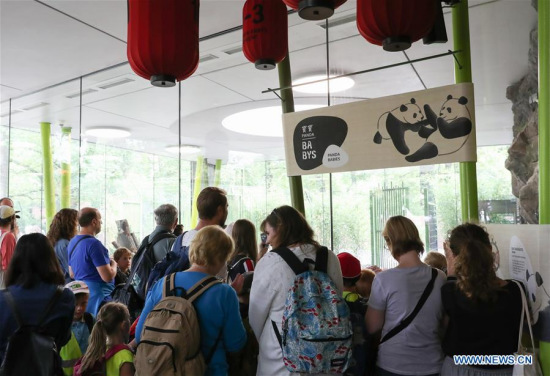 People visit the Panda Garden at Zoo Berlin in Berlin, capital of Germany, on July 6, 2017. Meng Meng and Jiao Qing, two pandas from southwest China's Sichuan Province, arrived in Berlin in late June. Starting Thursday, visitors to Zoo Berlin are able to see Meng Meng and Jiao Qing in their new garden, which occupies 5,500 square meters in area. (Xinhua/Shan Yuqi)