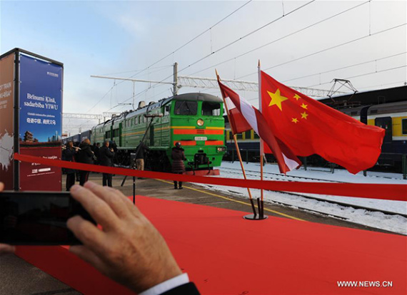 The freight train from Yiwu of China to Riga enters the Central Station of Riga, Latvia, Nov 5, 2016. The first trans-Eurasia container train linking China and Latvia arrived here on Saturday afternoon, marking a milestone in the history of the two countries' cooperation in transport and logistics sectors.(Photo/Xinhua)