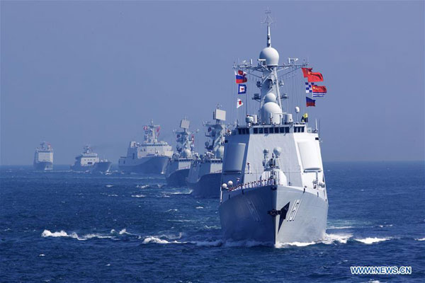 Chinese officers and soldiers waves to say goodbye to Russian fleet during a China-Russia naval joint drill at sea off south China's Guangdong province, Sept 19, 2016. (Photo/Xinhua)