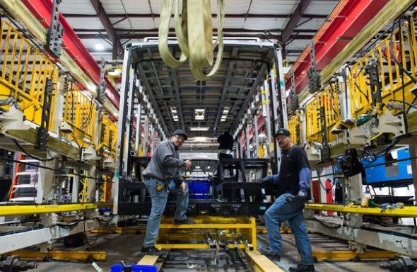 Workers man an assembly line at a BYD car manufacturing facility in Lancaster, California, in March. (Photo/Xinhua)