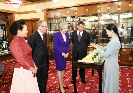 Chinese President Xi Jinping (2nd R) and his wife Peng Liyuan (1st L), and visiting British Prime Minister Theresa May and her husband Philip May, have an afternoon tea in Beijing, capital of China, Feb. 1, 2018. (Xinhua/Ding Lin)