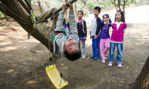 Students monkey around in the playground at the Spring Valley Waldorf School. Photo: Li Hao/GT