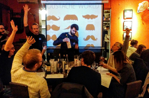 A wine-guessing game at Cafe de la Poste. (Photo provided to China Daily)