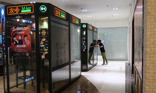Mini-karaoke booths are spreading across the country and gaining popularity among young people. (Photo: Li Hao/GT)
