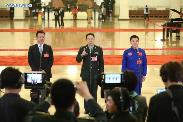 Delegates to the 19th National Congress of the Communist Party of China receive interview at the Great Hall of the People in Beijing on Wednesday. (Photo/Xinhua)