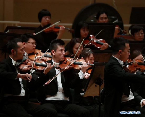 Members of the China National Center for the Performing Arts (NCPA) Orchestra perfom at the Symphony Center in Chicago, the United States, Oct. 28, 2017. A sold-out concert performed here Saturday by China NCPA Orchestra caught the attention of the whole audience by showcasing a unique combination of Western and Chinese music.(Xinhua/Wang Ping)