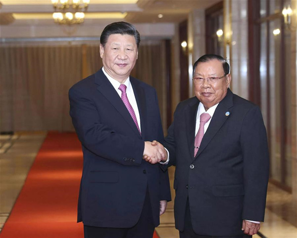 Chinese President Xi Jinping (L), also general secretary of the Communist Party of China Central Committee, meets again with Lao President Bounnhang Vorachit, also general secretary of the Lao People's Revolutionary Party Central Committee, in Vientiane, Laos, Nov. 14, 2017. (Xinhua/Ding Lin)