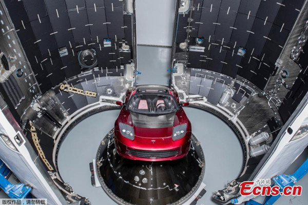 A red Tesla Roadster is seen during preparations to use it as a mock payload for the launch of a SpaceX Falcon Heavy rocket, in Cape Canaveral, Florida, U.S. December 6, 2017. (Photo/Agencies)