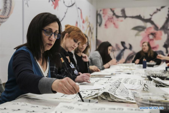 Participants learn how to write Chinese calligraphy at a workshop in Herakleidon Museum in Athens, Greece, on March 3, 2018. The goal of the educational workshop introducing Chinese culture at Herakleidon Museum free of charge on Saturday was to provide one more opportunity to Greeks to get to know a different way of thinking. (Xinhua/Lefteris Partsalis)
