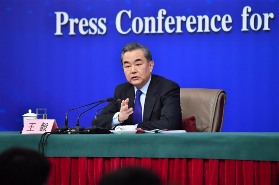 Chinese Foreign Minister Wang Yi answers questions on China's foreign policies and foreign relations at a press conference on the sidelines of the first session of the 13th National People's Congress in Beijing, capital of China, March 8, 2018. (Xinhua/Li Xin)
