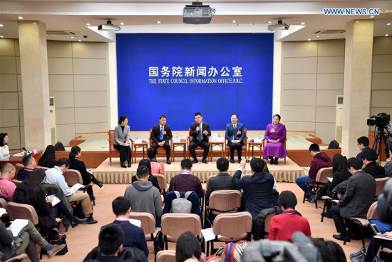 Zhao Huijie (1st R), Xiang Changjiang (2nd R), Li Jun (C) and Cao Qinghua (2nd L), deputies to the National People's Congress, attend a press conference to share their experiences on poverty alleviation in Beijing, capital of China, March 15, 2018. (Xinhua/Li Xin)