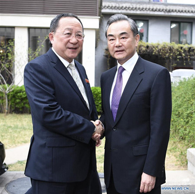 Chinese State Councilor and Foreign Minister Wang Yi (R) meets with the Democratic People's Republic of Korea (DPRK)'s Foreign Minister Ri Yong Ho, who stopped over in Beijing, capital of China, April 3, 2018. (Xinhua/Yan Yan)