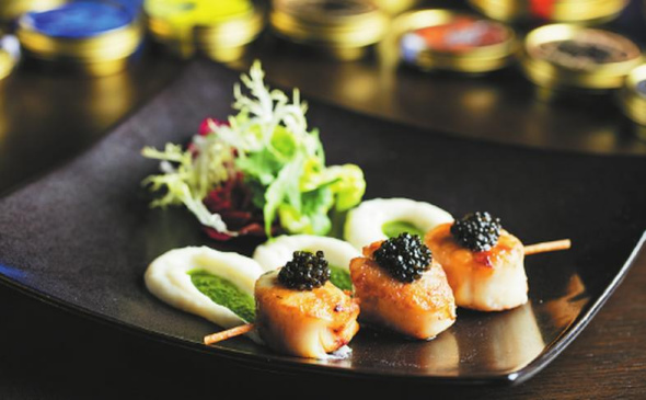 Pan-fried scallops topped with caviar from the Ritz Carlton Pudong hotel in Shanghai, one of the largest hospitality clients of Kaluga Queen in China.  (Photo provided to China Daily)