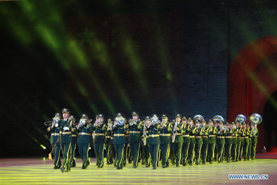 The military band of the Chinese People's Liberation Army (PLA) perform at the opening ceremony of a military band festival of the Shanghai Cooperation Organization (SCO) at a square of the Juyongguan Pass of the Great Wall in Beijing, capital of China, April 24, 2018. Military bands from eight countries, namely China, Kyrgyzstan, Pakistan, Russia, Tajikistan, Uzbekistan, India and Belarus, took part in the fifth SCO military band festival. (Xinhua/Ju Zhenhua)