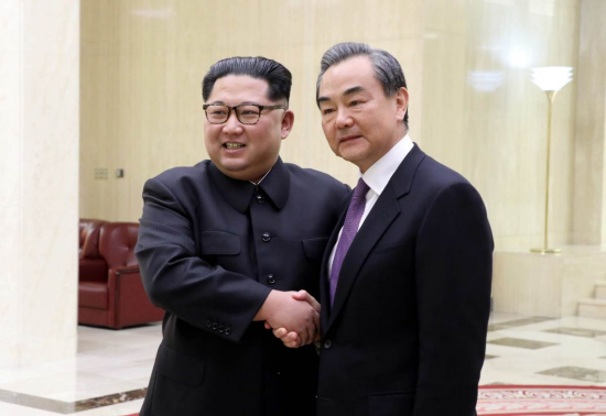 Kim Jong-un, top leader of the Democratic People's Republic of Korea, meets with State Councilor and Foreign Minister Wang Yi in Pyongyang on Thursday. Wang says Beijing supports the Korean Peninsula's shift from armistice to peace as well as Pyongyang's shifting focus toward an economic buildup. (Photo/Xinhua)
