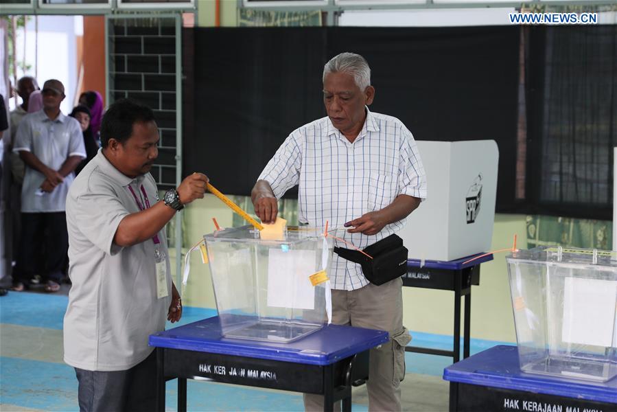 Malaysians vote in highly-contested election