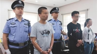 The defendants on trial in a local court on Tuesday. (Photo/Beijing News Photo)