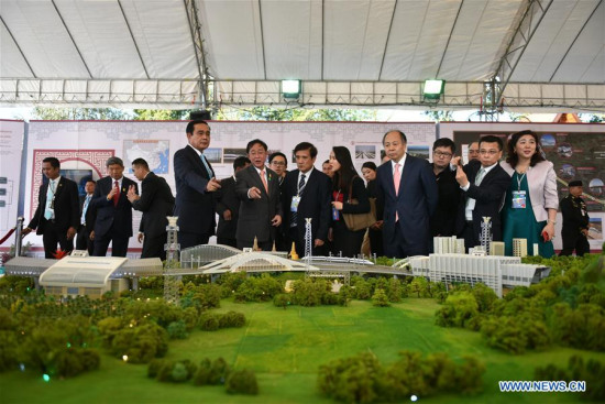 Honored guests visit a model of the first phase of the high-speed railway linking Bangkok with Nakhon Ratchasima province in Pak Chong, Thailand, Dec. 21, 2017. Thailand and China jointly inaugurated the construction of Thailand's first high-speed railway from Bangkok to northeastern province of Nakhon Ratchasima on Thursday. (Xinhua/Li Mangmang)