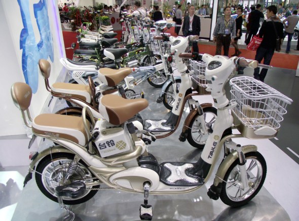 Electric bikes of TAILG Electric Vehicle Co Ltd are displayed at a new energy expo held in Nanjing, Jiangsu province. (Photo for China Daily/Zhen Huai)