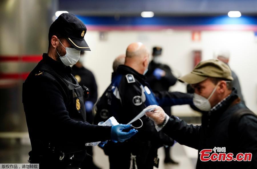 Free masks offered at metro station in Madrid