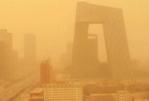 Sand blows in north China, rain in south