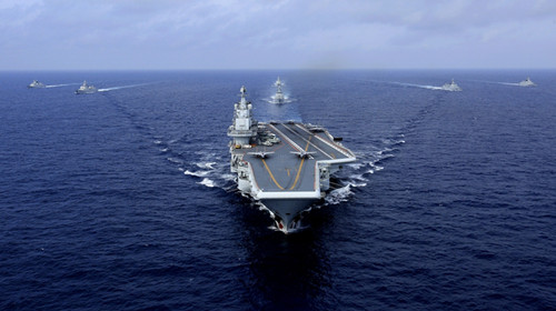 The aircraft carrier CNS Liaoning leads its battle group on its first combat exercise in the western Pacific on Friday. (Hu Kaibing/For China Daily)