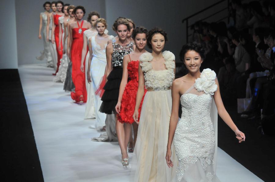Models display creations by HK fashion designer Dorian Ho in Shanghai ...