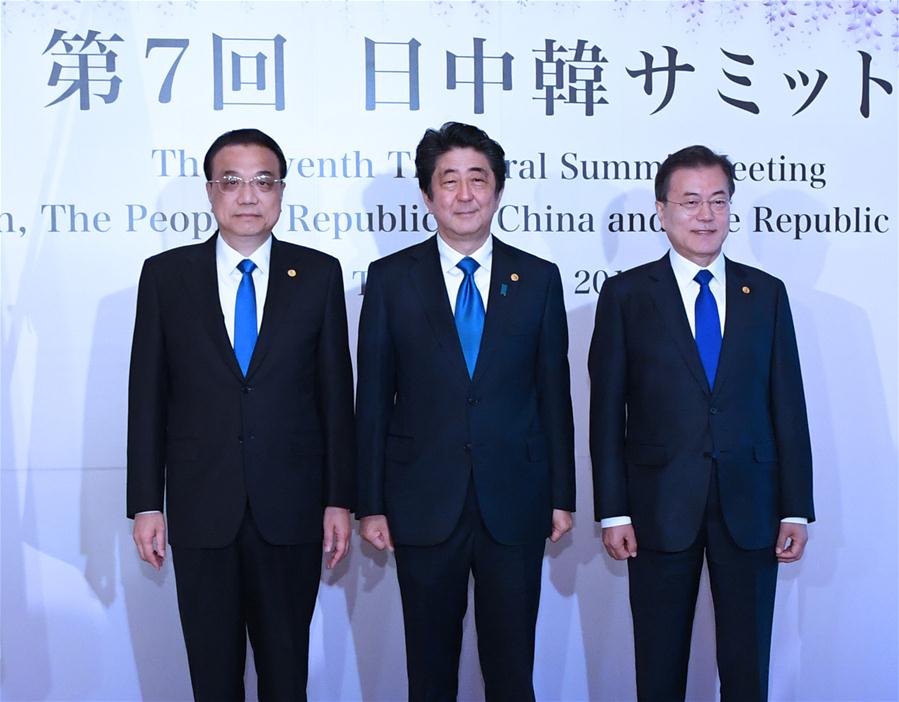 Abe's political fate and the trilateral summit